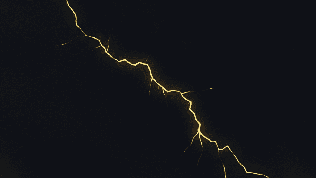 Abstract dark navy field with a single thin yellow fault line fracturing one corner